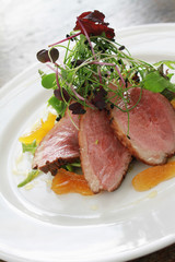 plated pan fried duck meal