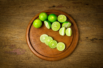 lime on choppping board wood on wood. wood background