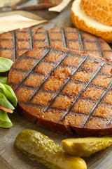 prepared vegan seitan burger meal