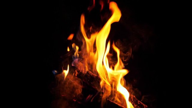 Slow motion of fire at bonfire in the dark