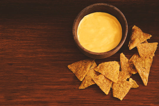 Top view of nachos with cheese dip