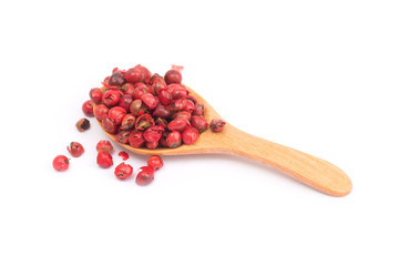 pink peppercorns isolated on white background, dried berries of Peruvian pepper tree