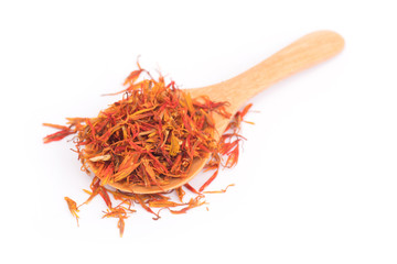 Fototapeta premium Dried safflower on wooden spoon isolated on white background