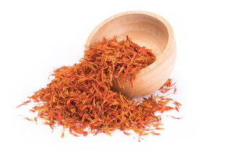 Dried safflower in wooden bowl isolated on white background