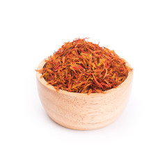 Fototapeta premium Dried safflower in wooden bowl isolated on white background