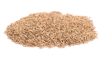 Pile of cumin seeds isolated on white background