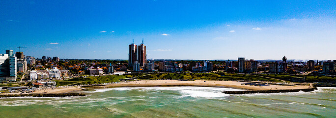 Fototapeta na wymiar Sky view of Mar del Plata Argentina – high resolution drone photo of the Argentinian coast and downtown area of Mar del Plata Casino Central in spring time. Buenos Aires Capital Federal district 