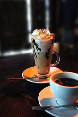 coffee on top with whip cream. Coffee drink. Chocolate frappe with syrup. espresso. cappuccino