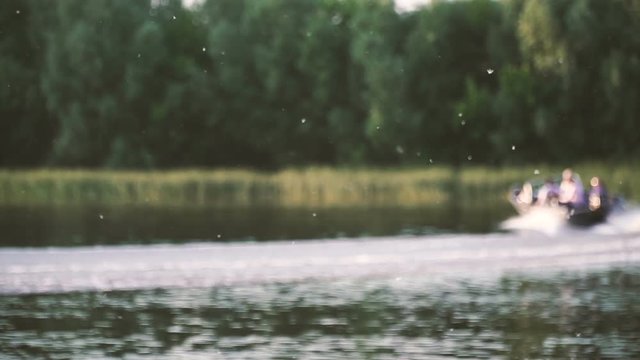 Powerboat. The boat swims along the river