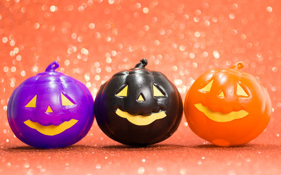 Halloween background concept. jack O pumpkin faces bright colorful orange backdrop.