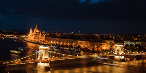 Fototapeta na wymiar Budapest at night. Danube river, Széchenyi Chain Bridge, and the Parliament building from the Buda castle in Hungary