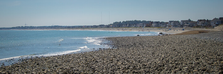 panoramic of rocky beach in hull MA at low tide