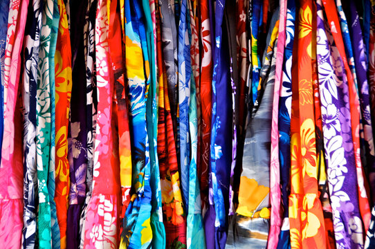 Hawaiian Print Abstract. A closely packed rack of colorful Hawaiian muumuu&rsquo;s 
