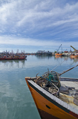 Fototapeta na wymiar Harbor landscape with fishing boat close-up