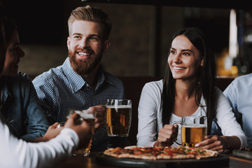 Company Friends Celebrating Drinking Beer in Pub