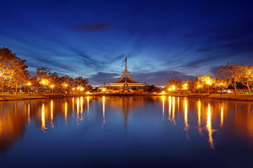 Fototapeta na wymiar Night light of water reflection of Ratchamangkhala Pavilion at Suan Luang Rama IX Public Park Bangkok,Thailand