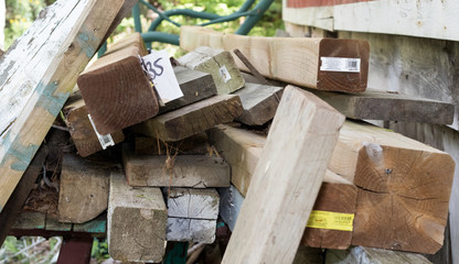 Lumber piled haphazardly, nobody.