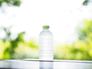 bottle of cold water on wooden table