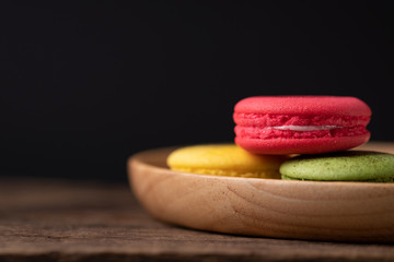 French Colorful Macarons Colorful  Macarons on Wood Background