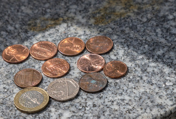 Coins on the headstone of a child drowned on the Titanic.