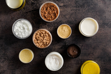 Different scrubs and body creams and cosmetics masks.