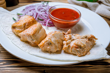 chicken kebab on board