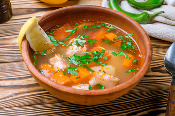 Fish soup on white plate