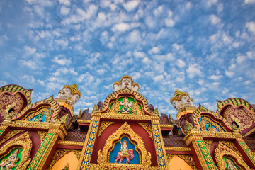 Fototapeta premium Wat Mahathat Wachiramongkol Former name (Wat Bang Tong) is located Krabi,The environment is rubber plantation. And oil palm plantation, a towering pagoda is beautiful, tourists are always watching.