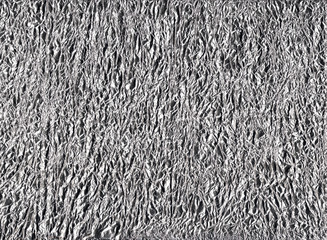 Shiny gray silver aluminum crumpled wrapping paper foil texture for wallpaper decoration element...
