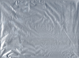Shiny gray silver aluminum crumpled wrapping paper foil texture for wallpaper decoration element...