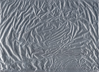 Shiny gray silver aluminum crumpled wrapping paper foil texture for wallpaper decoration element background, stock photo image