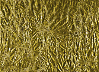 Shiny yellow gold crumpled wrapping paper foil texture for wallpaper decoration element background, stock photo image