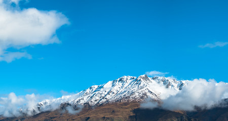 Panorama view. Stunning of the scenery of rocky mountain covered with snow after the raining day....