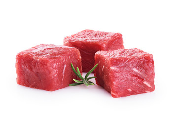 Fresh raw beef cubes and rosemary isolated on white background.