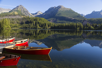 Colorful wooden boat on  mountain lake . Strbske Pleso. Slovakia.