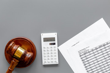 Declare bankruptcy concept. Judge gavel, financial documents, calculator on grey background top view