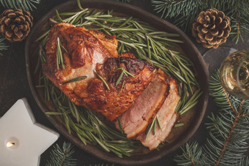 Baked Christmas ham with rosemary. Christmas background, top view.