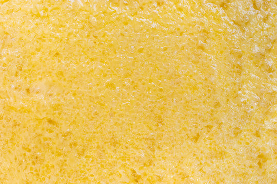 close up of butter and sugar texture spread on bread