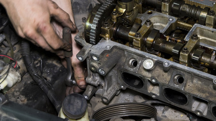 Mechanic repairs the car engine