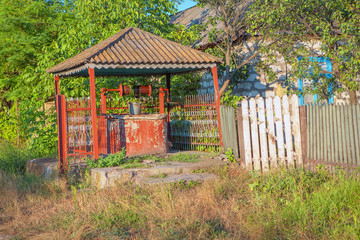 water well with a gazebo in village