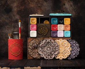 Stucco plaster (decorative medallion molding), Paints for painting on a wooden shelf and brush. Set for drawing and creativity
