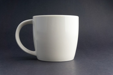 Cup of tea on dark background with selective focus and crop fragment
