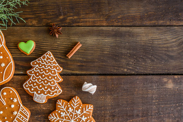 Christmas homemade gingerbread cookies on wooden table