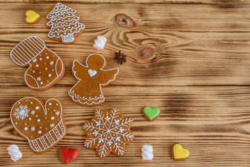 Christmas homemade gingerbread cookies on wooden table