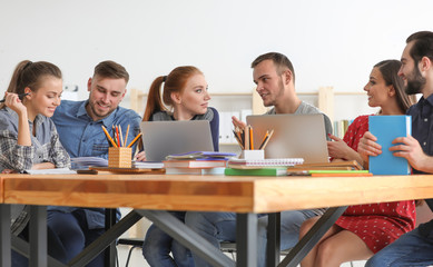 Students doing homework together in library
