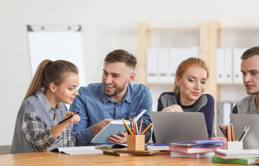 Students doing homework together in library