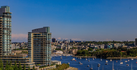 Obraz premium City skyline and waterfront on False Creek from Granville Bridge in Vancouver Canada