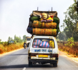 Overloaded lorry in Ghana, north of Accra.