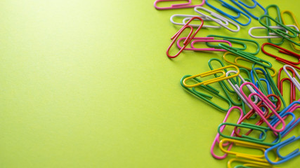 Color push pins on green background for copyspace