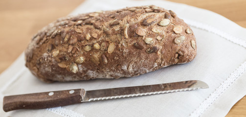 Fresh tasty wheat wholegrain brown bread with pumpkin seeds